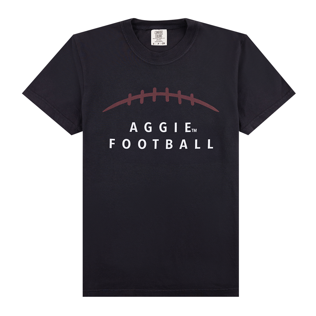 Black t-shirt with "AGGIE FOOTBALL" in white with maroon football stitching.