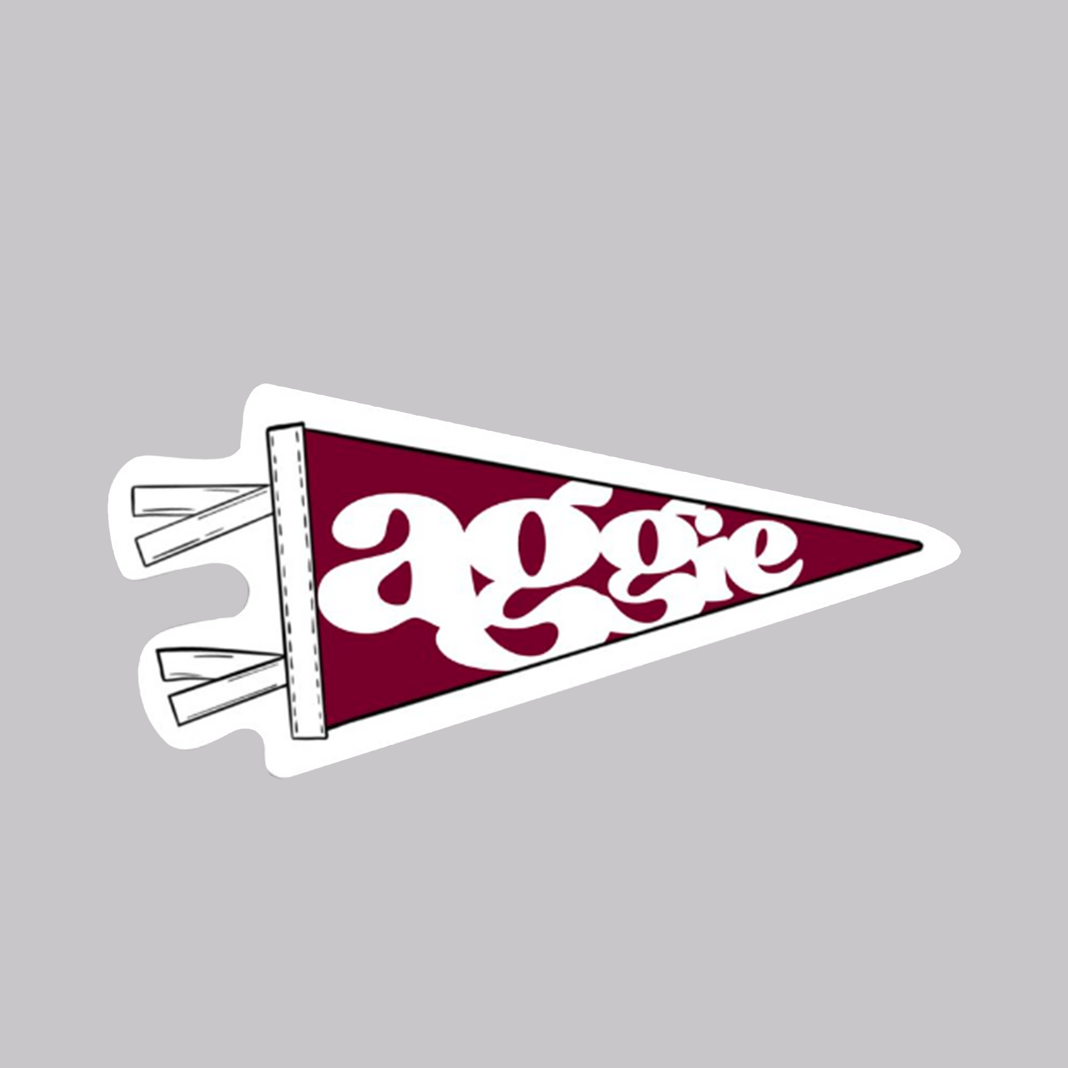 A maroon pennant with white 'aggie' script letters 