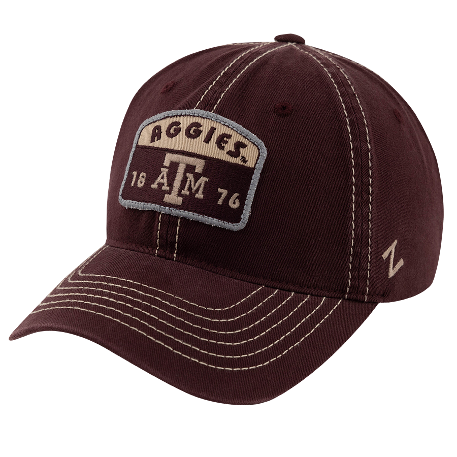 Maroon hat with patch that reads "Aggies ATM"