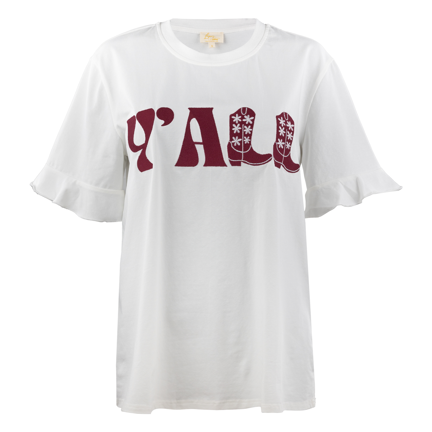 A white tee with a ruffle sleeve boarder. The Y' and A in 'YALL' is printed in maroon script letters. The two L's of YALL are maroon cowboy boots with white flowers on them. YALL is printed in the middle of the shirt.