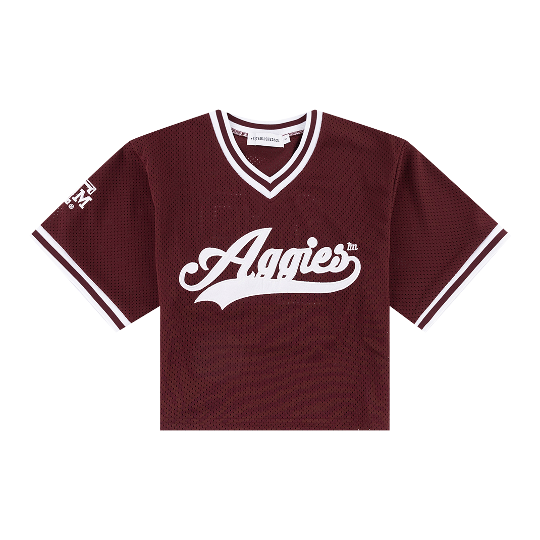 Maroon mesh cropped jersey with "Aggies" in white with a white 12 on the back and a white ATM logo on the sleeve.