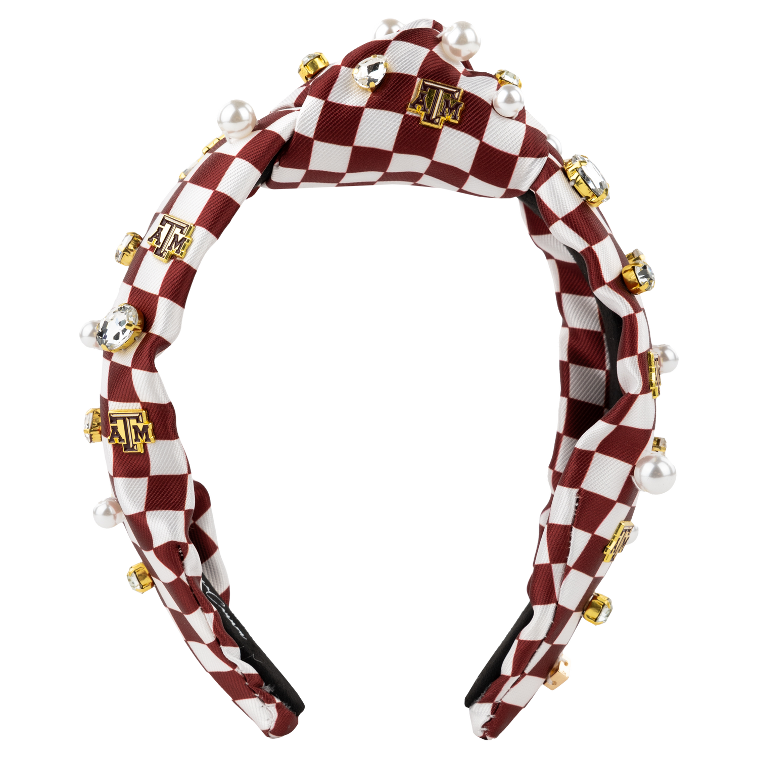 A maroon and white checkered knot style headband with pearls, gems, and A&M charms placed throughout