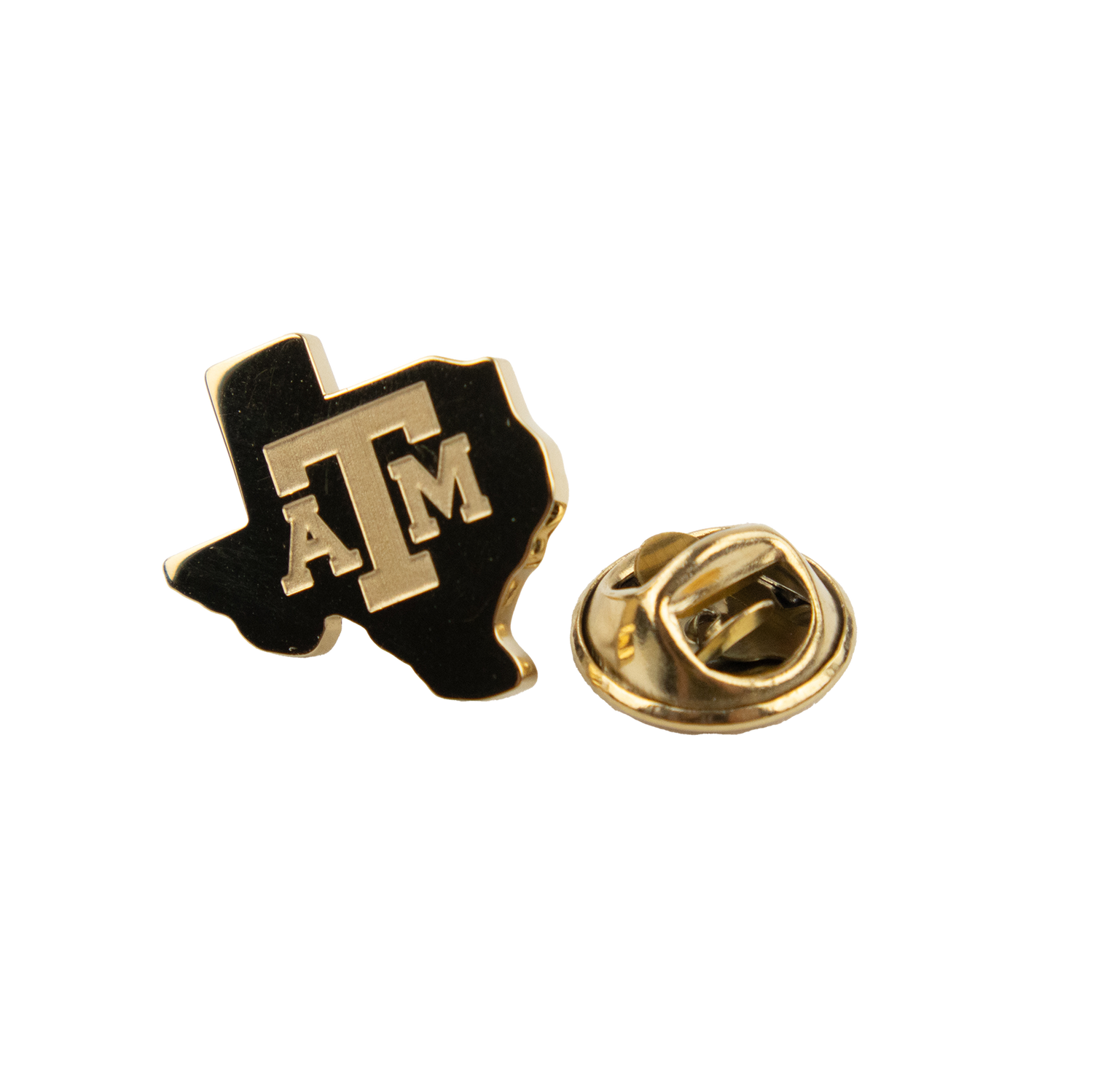 A gold texas shaped pin. A&M is printed in gold block letters on the front.