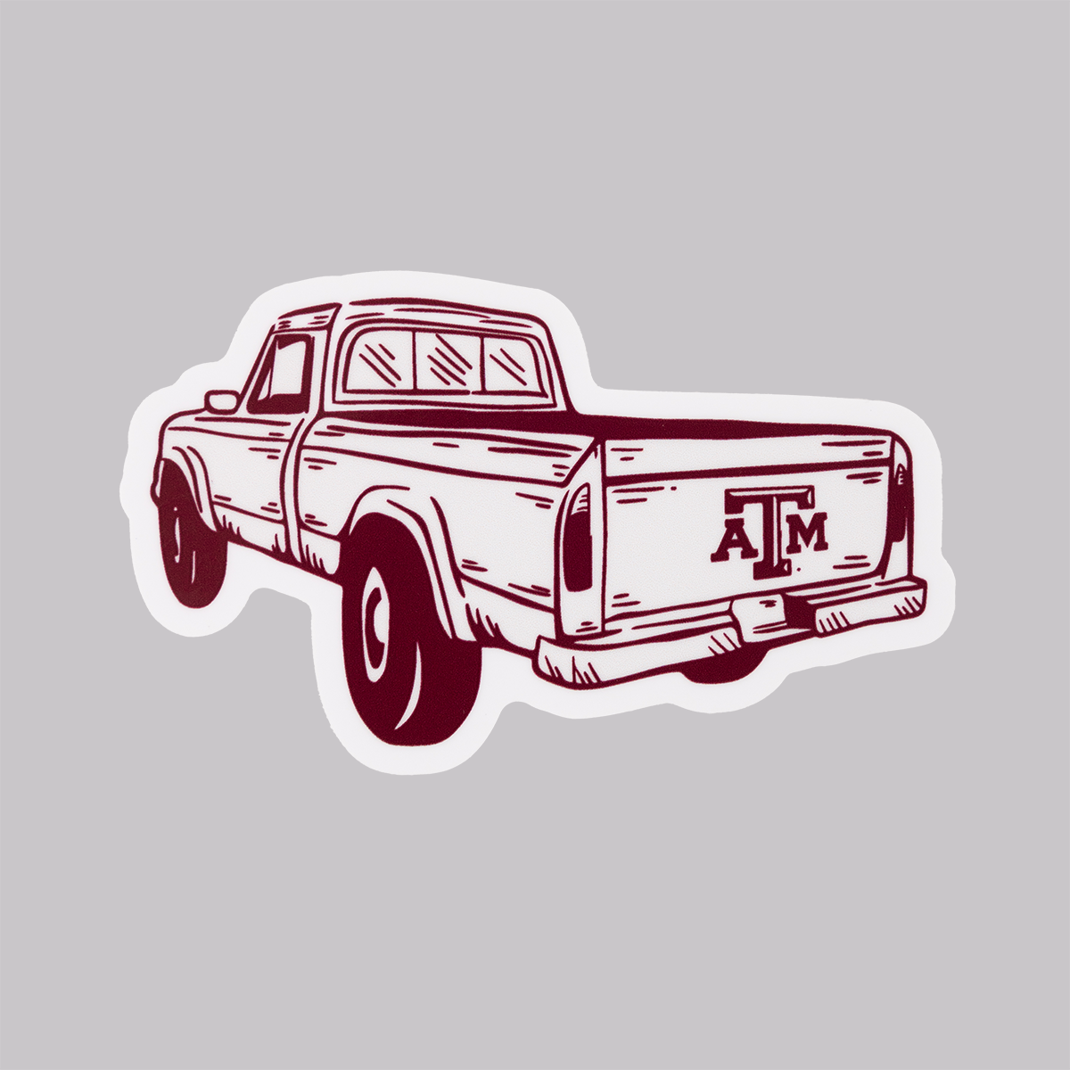 Maroon and White truck bed with ATM logo sticker