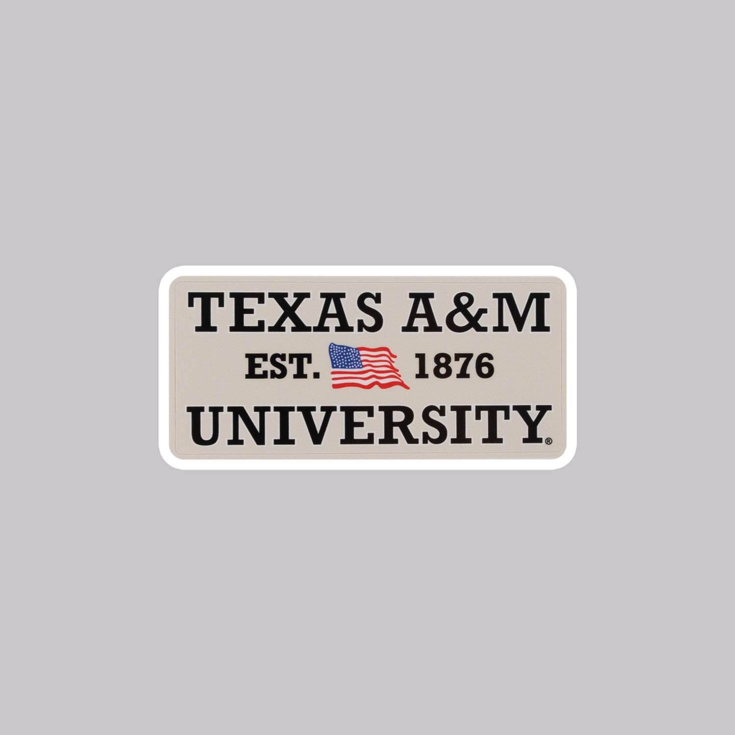 Sticker of the United States flag and "Texas A&M University" in black.