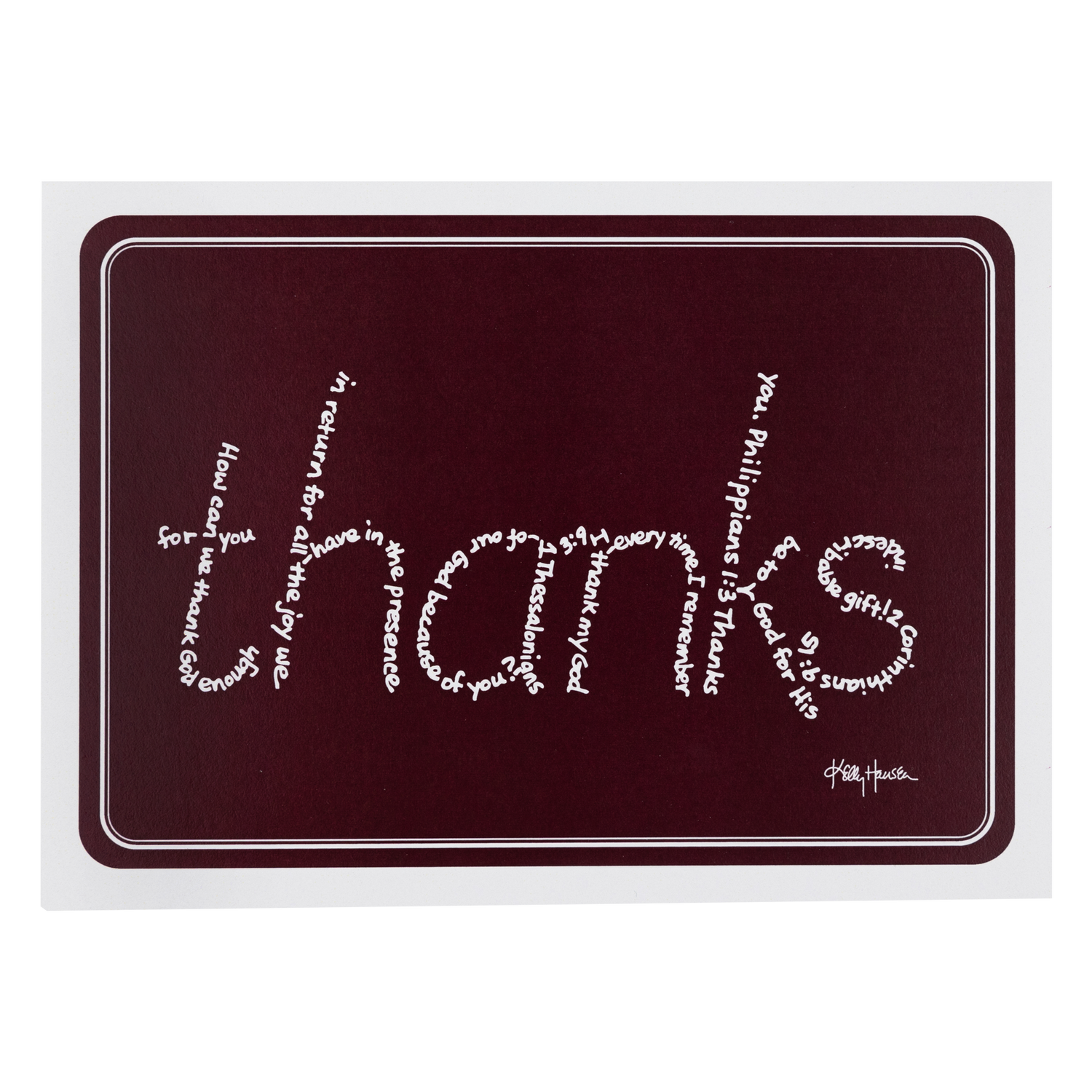 A maroon background note card with a white boarder. 'thanks' is written across the front in white letters made up of words. 